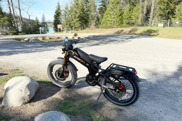 Aniioki A9 Pro Max in black parked outdoors on a gravel path, showing its robust frame and battery mount—ideal for demonstrating how to lock an e-bike securely